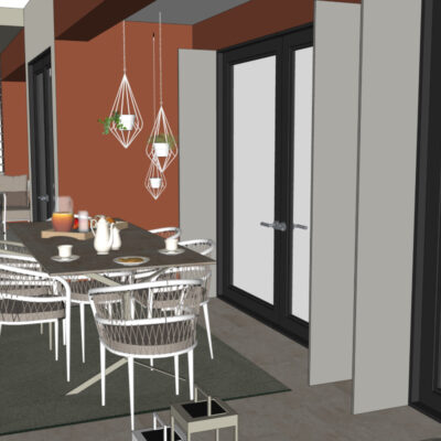 Vista di un terrazzo moderno con un tavolo da pranzo elegante, sedie bianche intrecciate e pareti colorate. Atmosfera accogliente con piante e decorazioni minimaliste.